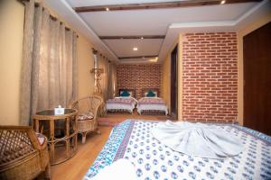 Letto o letti in una camera di Hong Si Hotel- A Home Away from Home