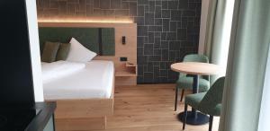 Appart Hotel Pitschonia Self Check-In客房内的一张或多张床位