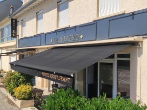 a black awning on the front of a building at Le BISTRO in Olemps