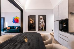 a living room with a table and a couch at ReMia Suites & Leisure in Alassio