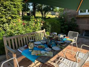a table with food on it on a patio at Villa Krafft Bed&Breakfast in Waake