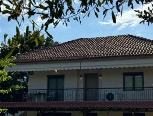 a large white house with a red roof at FILIRA Luxurious Apartment - by Ploumis in Stavros