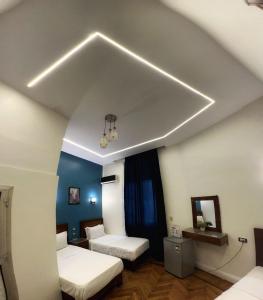 Voodi või voodid majutusasutuse Minerva Grand Hostel Cairo toas