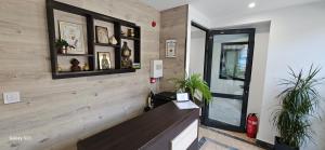 a lobby with a stairwell with a wooden wall at Guest House Saint Petka in Veliko Tŭrnovo