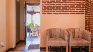 Area soggiorno di Hong Si Hotel- A Home Away from Home