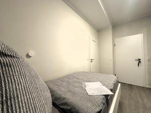 Ein Bett oder Betten in einem Zimmer der Unterkunft Simplex Stays Hotel Quartier 8