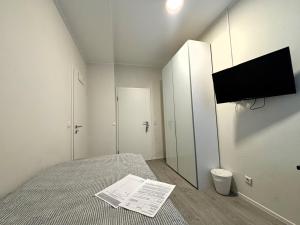 TV/Unterhaltungsangebot in der Unterkunft Simplex Stays Hotel Quartier 8