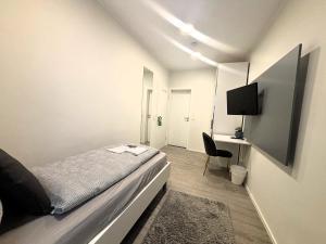 TV/Unterhaltungsangebot in der Unterkunft Simplex Stays Hotel Quartier 8