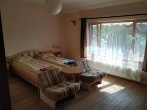 Postel nebo postele na pokoji v ubytování Smaidas apartamenti