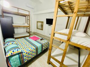 Postel nebo postele na pokoji v ubytování Hostal Badillo SV