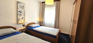 Postel nebo postele na pokoji v ubytování Apartment Samlandin