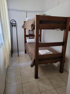 a room with a bunk bed and a tiled floor at la florida C in Salta
