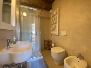 a bathroom with a sink and a toilet and a shower at Alloro 6 in Marciana Marina +18 photos
