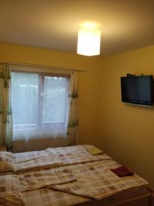 Postel nebo postele na pokoji v ubytování Smaidas apartamenti