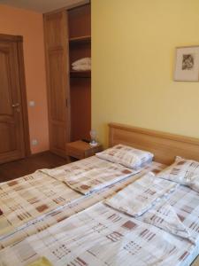 Postel nebo postele na pokoji v ubytování Smaidas apartamenti