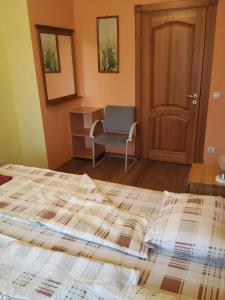 Postel nebo postele na pokoji v ubytování Smaidas apartamenti