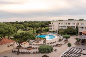 an aerial view of a hotel with a pool and trees at Onyria Quinta da Marinha Hotel in Cascais