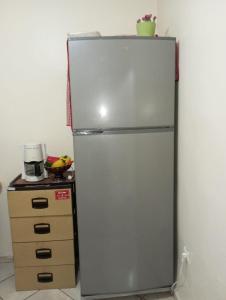a refrigerator in a kitchen next to a dresser at Elbernoussi in Casablanca