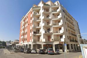 a tall building with cars parked in front of it at Charm Room 22 in Termoli