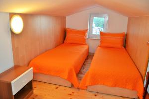 Postel nebo postele na pokoji v ubytování Apartments Tanja + 32 fotografií