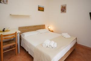 A bed or beds in a room at Casa Vacanza Russo Fernando