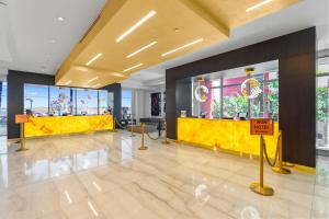a lobby with a yellow counter in a building at Nido del amor in Hollywood +14 photos
