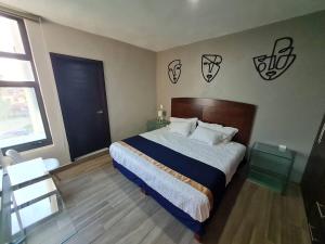 เตียงในห้องที่ Casa Arandas Hotel - Suits