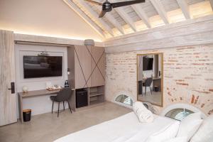TV a/nebo společenská místnost v ubytování Lunalá Hotel Boutique