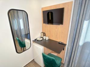 a small room with a desk and a mirror at Elafonisi Paradise with Parking, WiFi, - Walking Distance to the Beach in Elafonisi +37 photos