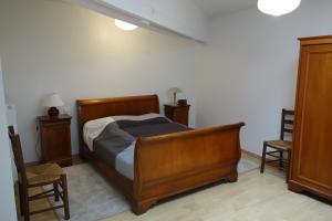 Postel nebo postele na pokoji v ubytování Le Logis de Loulou