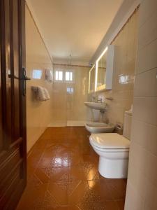 a bathroom with two toilets and a sink at Villa Carmiña in Puerto del Carmen +65 photos