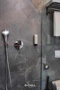 a bathroom with a shower with a glass door at B-Chill Cologne in Cologne +47 photos