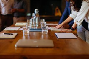 a group of people standing around a table with a laptop at Moinho do Duque in Runa