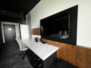 TV a/nebo společenská místnost v ubytování Grand Hotel Times Levis