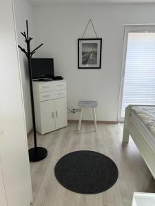TV a/nebo společenská místnost v ubytování Resi's Gästehaus