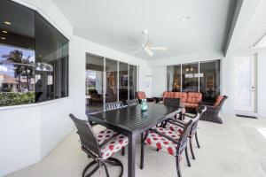 a dining room with a table and chairs at Pet-friendly waterfront home near beach with pool in Marco Island