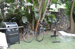 two bikes parked next to a grill and a stove at Villa Grazia in Aci Catena