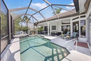 an image of a swimming pool in a house at Waterfront home on key lot with pool and sundeck in Marco Island