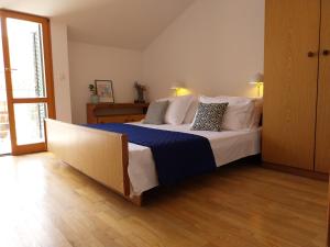 Postel nebo postele na pokoji v ubytování Apartments Miodrag