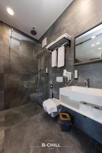 a bathroom with a sink and a shower at B-Chill Cologne in Cologne