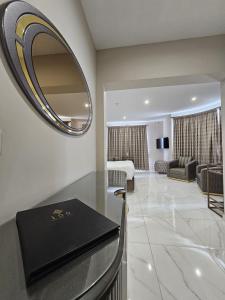 a bathroom with a mirror and a living room at 100 Boutique Living in Rabat +33 photos