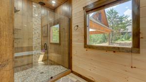 a bathroom with a shower with a glass door at 4 Leaf Clover in Blue Ridge +61 photos
