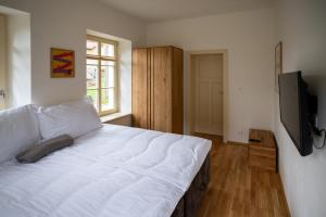 Postel nebo postele na pokoji v ubytování Apartmány Josefův Důl - Lesní Brána