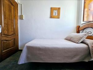 Postel nebo postele na pokoji v ubytování El Asturiano