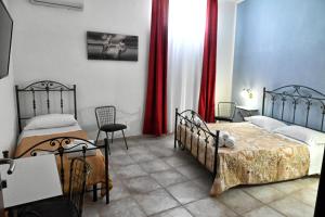 Postel nebo postele na pokoji v ubytování La Corte di Bacco Salento