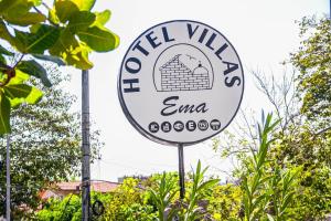 a sign for a mill village ema at Hotel Villas Ema in Zihuatanejo