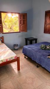 Cama ou camas em um quarto em Caminhos do Mar Hostel