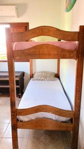 Cama ou camas em um quarto em Caminhos do Mar Hostel