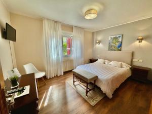 TV a/nebo společenská místnost v ubytování Hotel La Rivera