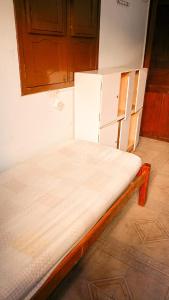 Cama ou camas em um quarto em Caminhos do Mar Hostel